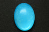 24.72ct Synthetic Blue Opal with Green Fire Oval Cabochon 24x18 mm Lab Created