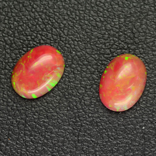 1.39ct 2pcs Set Synthetic Red Opal with Green Fire Oval Cabochon Lab Created