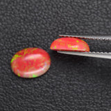1.39ct 2pcs Set Synthetic Red Opal with Green Fire Oval Cabochon Lab Created