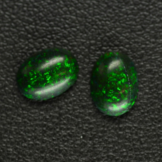 1.31ct 2pcs Set Synthetic Black Opal with Green Fire Oval Cabochon Lab Created